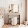 A bedroom scene featuring a vanity table with a mirror, makeup, and a stool, next to a bed. Produktbild-Vorschau