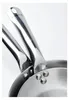 A close-up shot of the handles and rivets of two stainless steel frying pans. Náhled obrázku produktu