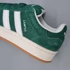 A close-up view of a green Adidas Campus sneaker. Podgląd zdjęcia produktu