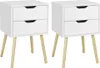 Two white nightstands with wooden legs are shown against a white background. Produktbild-Vorschau