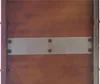 A close-up view of a Corten steel panel with a metal strip and bolts. Produktbild-Vorschau