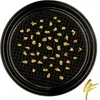A close-up view of gold nuggets in a black sieve. Produktbild-Vorschau