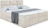 A bed with pillows and a blanket. Produktbild-Vorschau