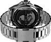 The back of a silver Timex watch with a metal band is shown against a white background. The watch face has a globe design and text. Voir les images du produit