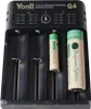 A close-up shot of a battery charger with batteries inserted. Produktbild-Vorschau