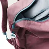 A close-up view of an open backpack, showing the zipper and interior. Produktbild-Vorschau