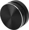 A close-up view of a black, circular object with a silver rim. Náhľad obrázku produktu