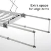 Close-up view of a ceiling-mounted automatic clothes drying rack, highlighting its extendable arms for large items. Produktbild-Vorschau