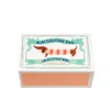A product shot of a small box with a dachshund illustration on it. Produktbild-Vorschau