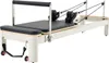 A Pilates reformer machine on a white background. Podgląd zdjęcia produktu