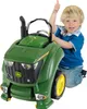 A young boy is sitting on a toy John Deere tractor and giving a thumbs up. Anteprima dell’immagine prodotto