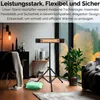 A modern living room with a heater on a tripod stand. Produktbild-Vorschau