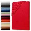 A red fitted sheet is shown on the right, with a stack of fitted sheets in various colors on the left. Produktbild-Vorschau