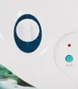 Close-up of the control panel of a white appliance, showing a timer dial and an on/off button. Náhľad obrázku produktu