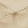 A close-up view of a tufted beige cushion or mattress. Náhled obrázku produktu