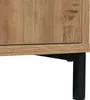 Close-up of the bottom corner of a wooden cabinet with black metal legs. Anteprima dell’immagine prodotto