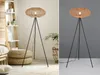 A split image showing a floor lamp in two different settings: one in a room with furniture and decor, and the other on a plain gray background. Produktbild-Vorschau