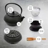 A collection of tea set items laid out on a textured surface, with dimensions and capacity indicated by overlaid text. Produktbild-Vorschau