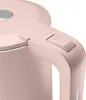 A close-up shot of the handle and switch of a pink electric kettle. Produktbild-Vorschau
