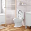 A white toilet with a marble-patterned lid in a bathroom. Produktbild-Vorschau