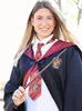 A young woman dressed as a Gryffindor student from Harry Potter, holding a wand. Produktbild-Vorschau