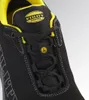 A close-up view of the top of a black safety shoe with yellow accents. Produktbild-Vorschau