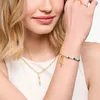 Close-up of a woman wearing jewelry. Náhled obrázku produktu