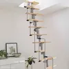 A spiral staircase in a room with white walls and a white cabinet. Produktbild-Vorschau