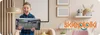 A young boy excitedly holding a toy tank in a room with decorative elements. Anteprima dell’immagine prodotto