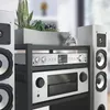 A close-up view of a modern HiFi system with speakers and audio equipment. Anteprima dell’immagine prodotto