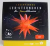 The image shows the packaging of a red LED star decoration. Produktbild-Vorschau