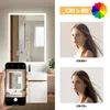 A bathroom mirror with integrated LED lighting, shown in use with a smartphone capturing its reflection, alongside marketing images highlighting color rendering index (CRI) comparisons. Produktbild-Vorschau