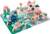 A collection of wooden building blocks arranged to form a miniature town on a play mat. Náhled obrázku produktu