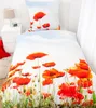 A bed with a duvet cover and pillow featuring a poppy flower pattern. Produktbild-Vorschau