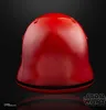A red helmet with a black stripe around the base, set against a black background. Produktbild-Vorschau