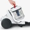 A person's hand is shown removing the dustbin from a white and gray vacuum cleaner. Anteprima dell’immagine prodotto