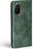 A close-up view of a green flip phone case with a camera cutout. Produktbild-Vorschau