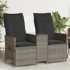 Two outdoor chairs with cushions and a small table between them, set on a patio. Podgląd zdjęcia produktu