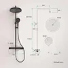 A technical drawing of a black shower system with dimensions and details. Produktbild-Vorschau