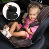 A young girl is sitting in a car seat in a car. Produktbild-Vorschau