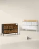 Two dressers are displayed on a stage-like platform against a plain background. Náhled obrázku produktu