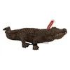 A toy crocodile on a white background. Anteprima dell’immagine prodotto
