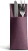 A fork and knife are neatly placed inside a purple napkin or cutlery holder. Produktbild-Vorschau