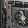 Close-up view of the interior of a computer case, showing a fan and some internal components. Produktbild-Vorschau