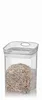 A clear studio shot of a transparent food storage container filled with what appears to be grains or seeds, set against a white background. Voir les images du produit