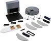 A collection of robot vacuum cleaner accessories, including a charging station, brushes, mop pads, and dust bags, laid out on a white background. Produktbild-Vorschau