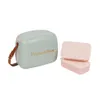A retro-style cooler box and two lunch boxes on a white background. Produktbild-Vorschau