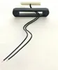 A black rectangular LED light with two black wires attached, mounted on a white background. Produktbild-Vorschau