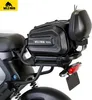 A black Wildman bicycle luggage bag mounted on the rear rack of a bicycle, shown against a white background. Produktbild-Vorschau