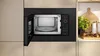 A built-in microwave oven with its door open, revealing the interior, is shown in a modern kitchen setting. Anteprima dell’immagine prodotto